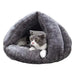Cozy luxe plush cat cave bed with playful hanging ball for endless fun
