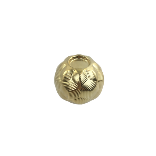 Chic gold Demi Ball Candle Holder is casting soft, inviting light in a cozy room