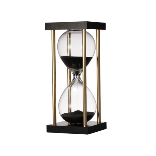 Elegant golden stand hourglass showcasing black sand to mark time beautifully.