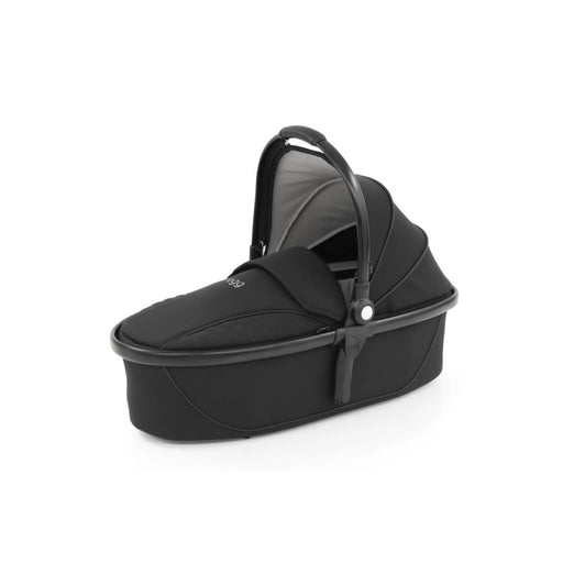 Nestling newborn dreams in the Love N Care Egg2 Carry Cot, Just Black edition
