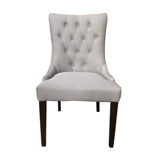 A Beige Athena Dining Chair in light grey, gracefully poised, blending timeless elegance with modern luxury