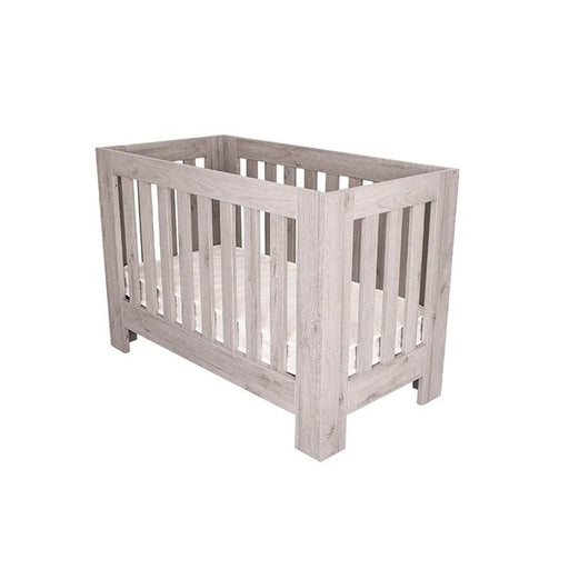 The Love N Care Stan Mini Cot fitting seamlessly through a standard door frame for easy room placement