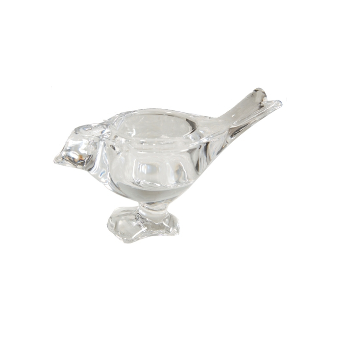 Captivating Glass Tealight Candle Holder is casting a warm, inviting glow in a cozy room setting