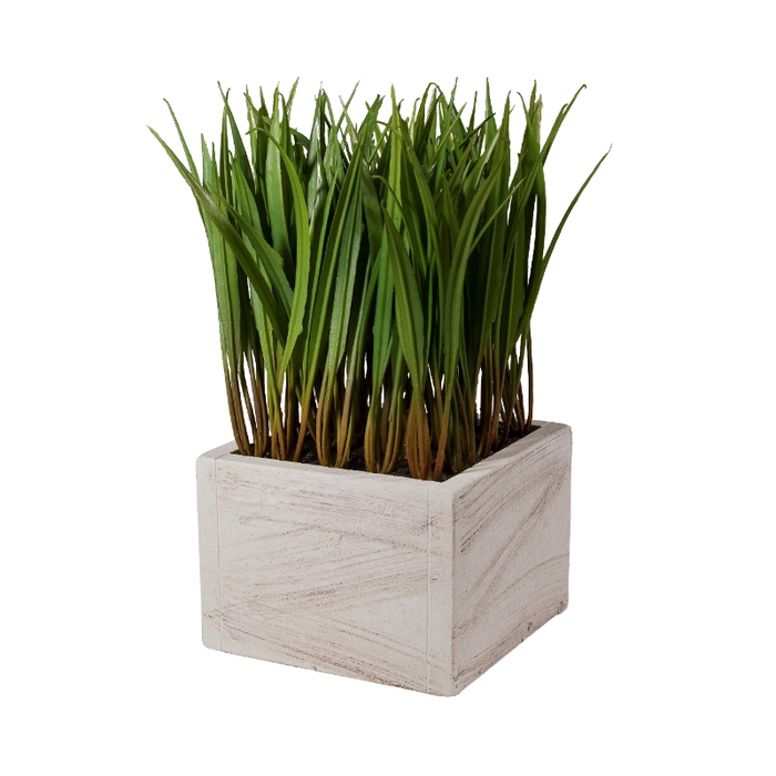 Plush faux-grass planter adding a green touch to a modern living space