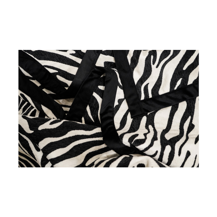 Close-up showcasing the intricate zebra pattern and luxe black trim