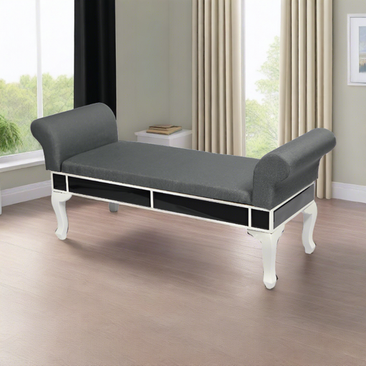 Chic black mirrored bench enhancing the luxury of a modern living room.