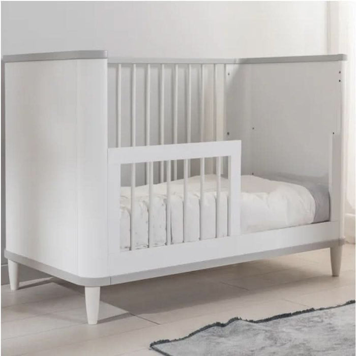 Adjustable mattress levels highlighted in the versatile Love N Care Noor Cot White