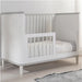 Adjustable mattress levels highlighted in the versatile Love N Care Noor Cot White