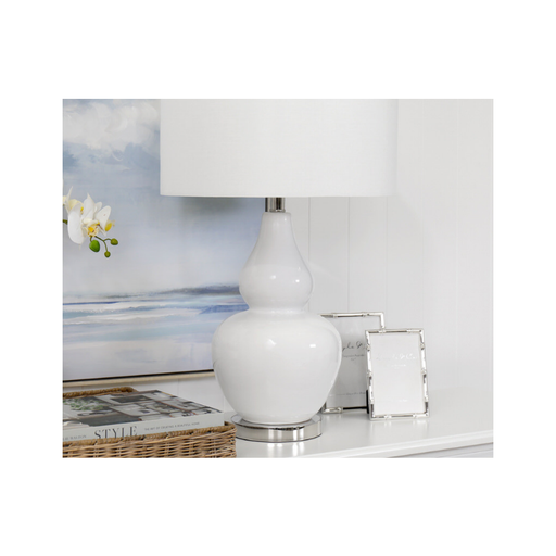 Capture the essence of coastal sophistication with our ceramic glass and aluminium table lamp