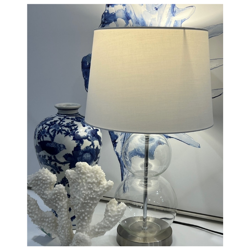 Capture the calm essence of the sea with our beautifully designed clear glass table lamp