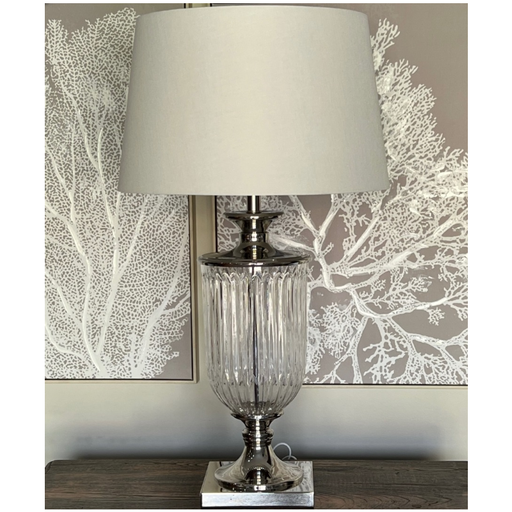 Milan Glass Lamp with White Shade creating a serene ambience in a stylish living room setting