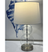 Let the light of the Coastal Clear Glass Table Lamp guide you to a serene home ambience