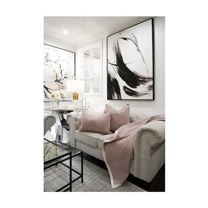 The Blush Ambiance Throw adding a splash of colour to a minimalist room setting