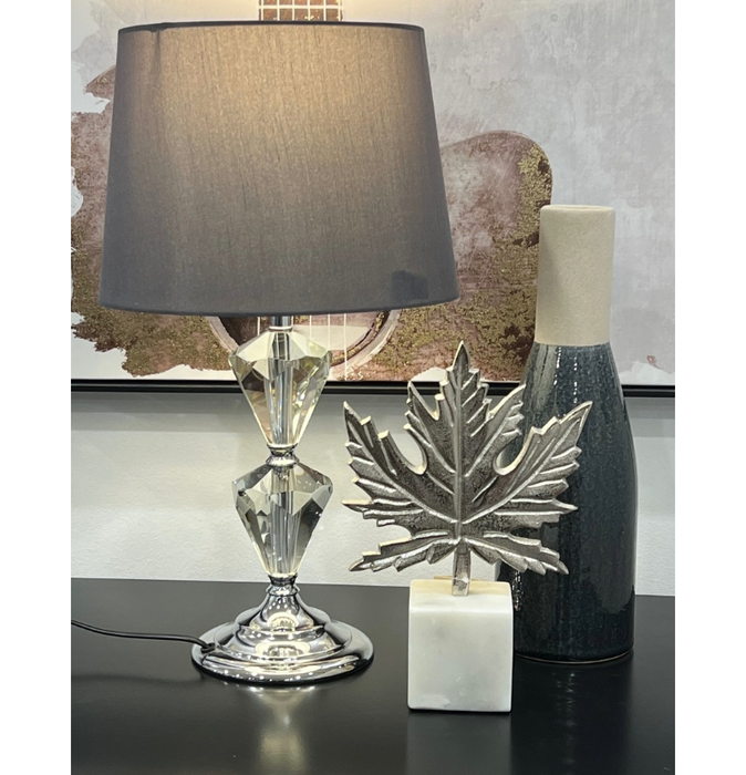 Illuminating Elegance: Silver-Shaded Lamp in a Modern Space