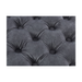 Detail of the textured velvet surface on a contemporary grey ottoman