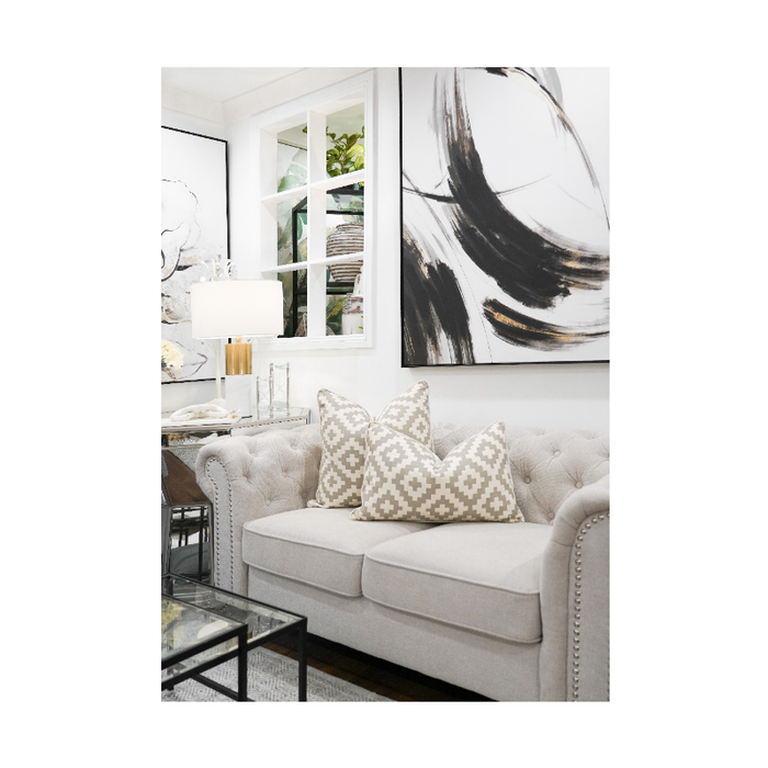 Geometric Silhouette Cushion Cover is adding a modern twist to a classic sofa