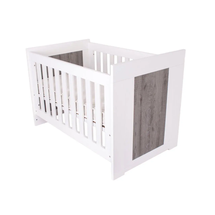 Chic Love N Care Lucca Cot White & Ash set in a minimalist nursery, showcasing the nursery of modern dreams