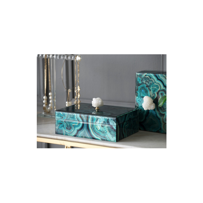Luxurious marbled keepsake box resting elegantly on a dresser