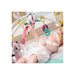 baby lying on the Tiny Princess Tales Gymini Deluxe, surrounded by captivating, colourful toys.