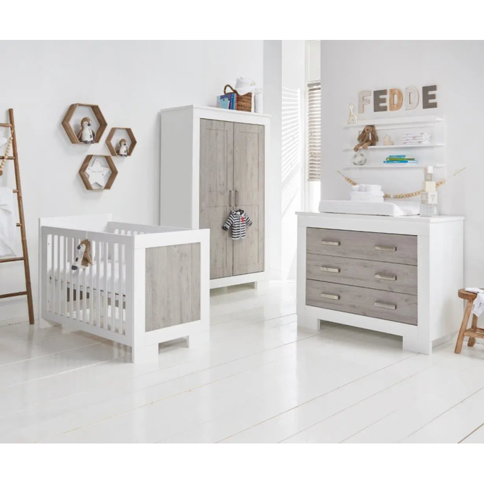 Elegant view of the Love N Care Lucca Chest in White & Ash setup in a well-lit nursery, blending functionality with modern decor