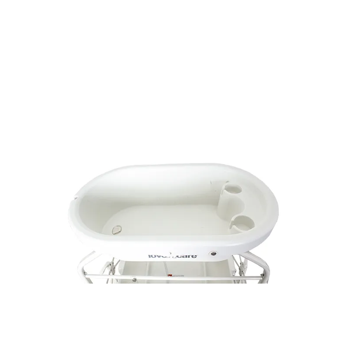 Celeste Change Table in bathtub mode with built-in drainage system for easy cleanup