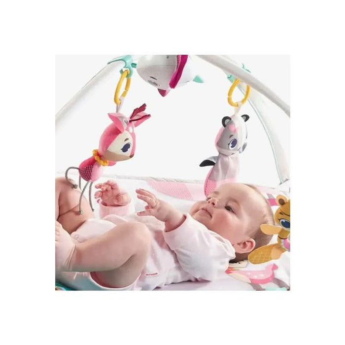 interactive toys dangling from the adjustable arches of the baby playmat.