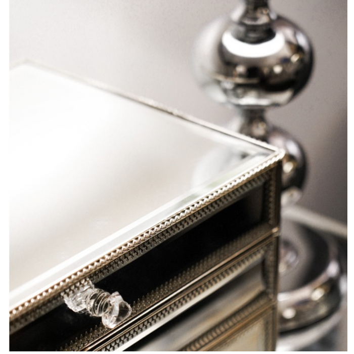 Contemporary silver jewellery box with intricate bevelled design