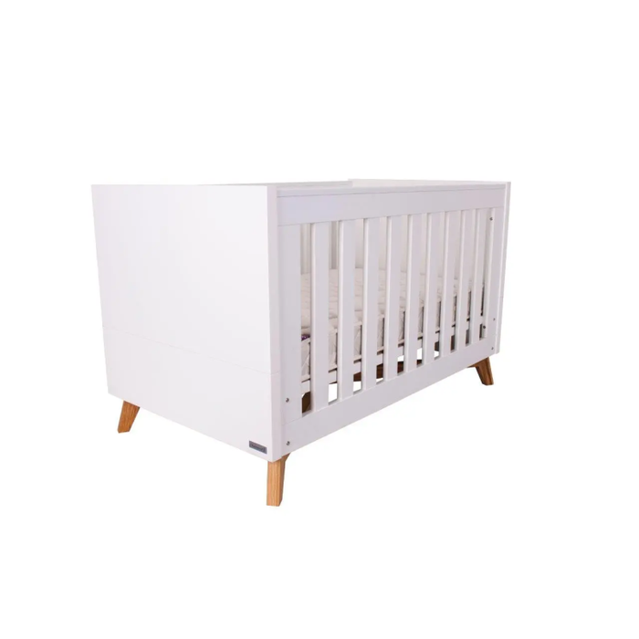 Love N Care Fjord Cot elegantly converted into a junior bed, prepared for a growing child