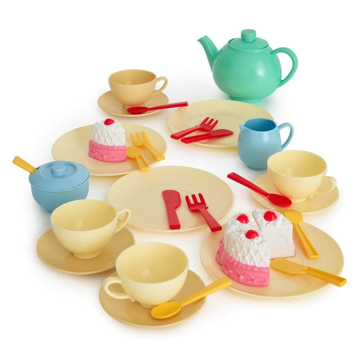 Young children joyfully arranging their Casdon Delightful Pastel Tea Set for an afternoon tea party."